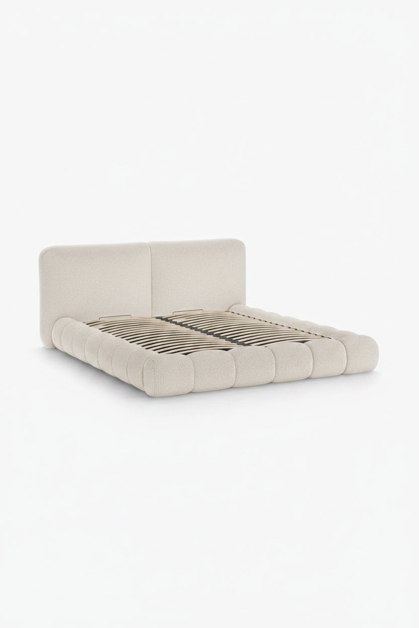 Beige upholstered bed with wooden slats on a white background