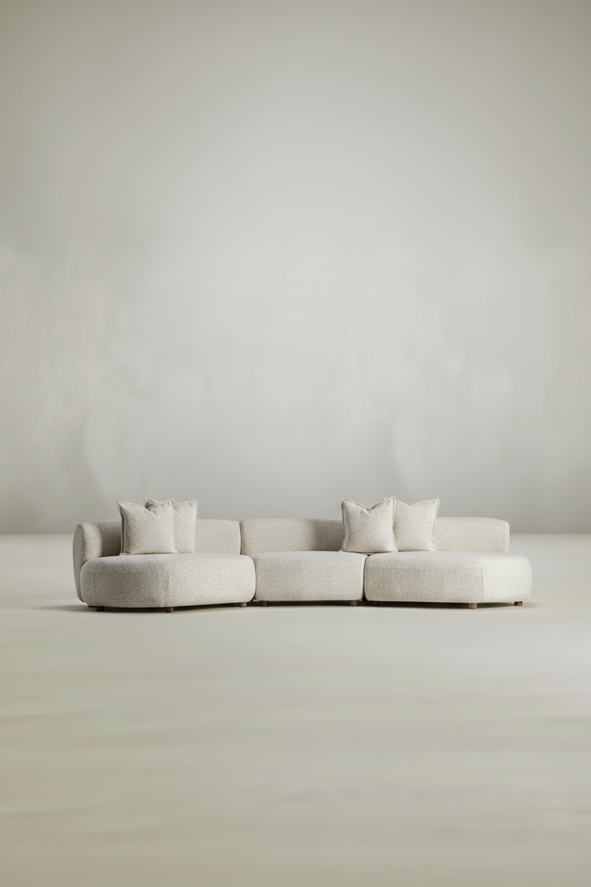 Beige sectional sofa against a plain background
